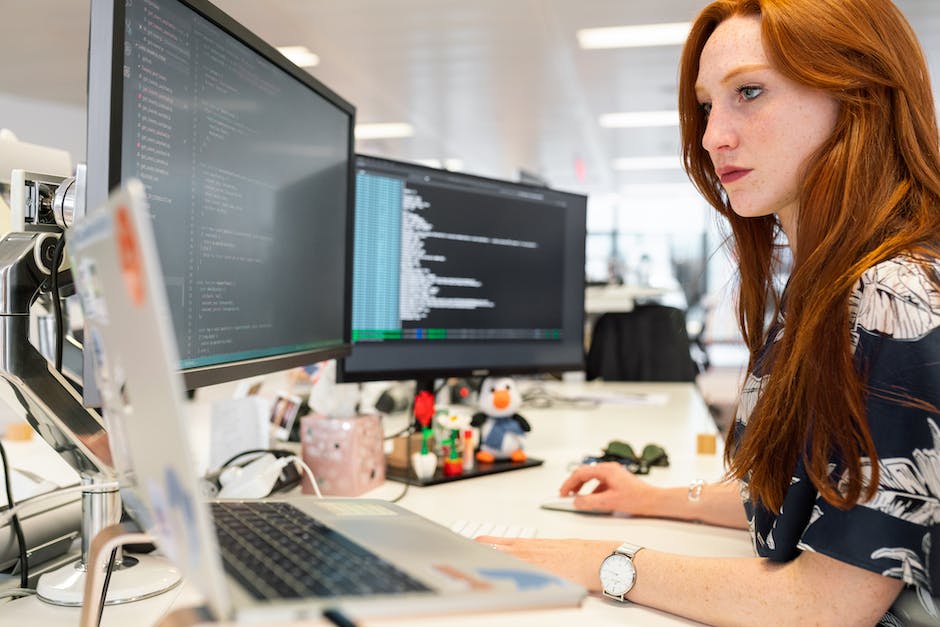 Image of a person using a computer with automated gears and arrows symbolizing automation features