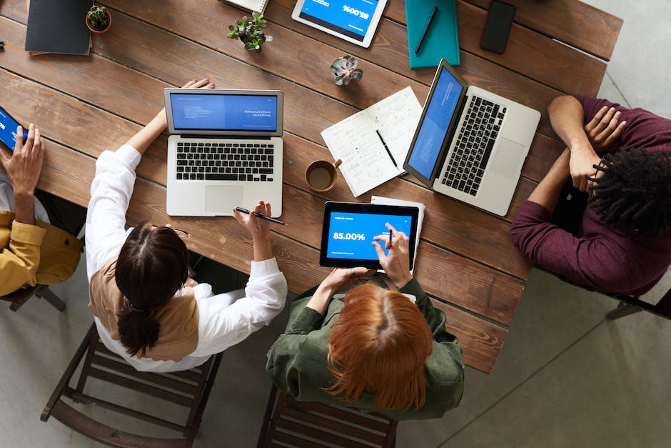 A group of developers coding with Nuxt 3 on their laptops